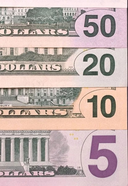 Tagihan dolar abstrak dengan latar belakang denominasi yang berbeda . — Stok Foto