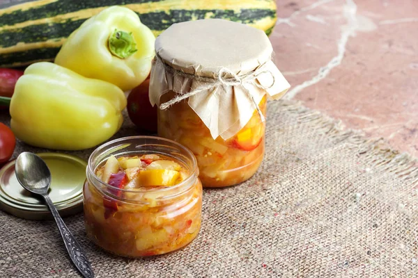Homemade preserving. Zucchini and bell pepper salad in glass jar — Stock Photo, Image