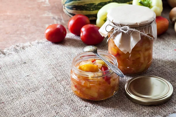 Homemade preserving. Zucchini and bell pepper salad in glass jar — Stock Photo, Image