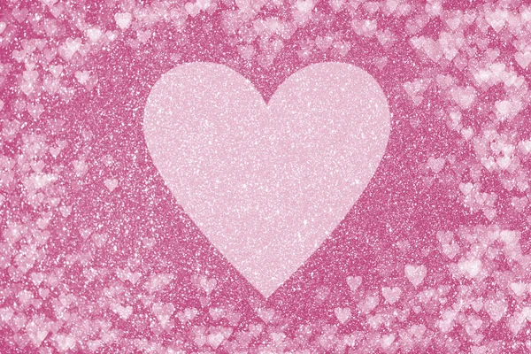 Glänzend rosa Hintergrund mit Glitzereffekt und herzförmigem Bokeh. glänzend rosa Hintergrund mit Glitzereffekt und herzförmigem Bokeh. großes blasses Herz in der Mitte. Valentinstag und Liebeskonzept — Stockfoto