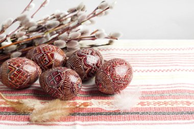 Easter still life with Pysanka on traditional Ukrainian cloth. Decorated Easter eggs, traditional for Eastern Europe culture. Copy space clipart