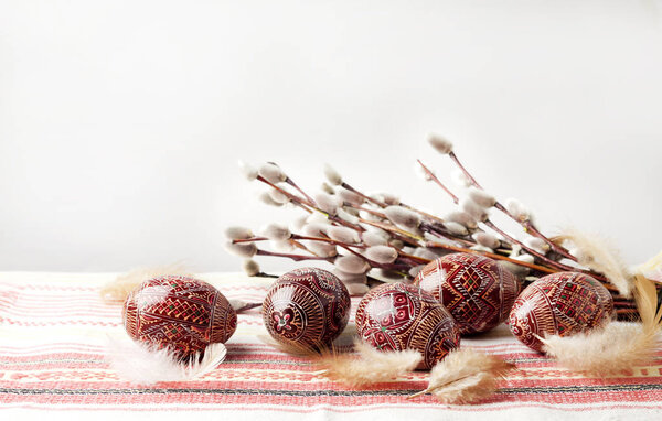 Easter still life with Pysanka on traditional Ukrainian cloth. Decorated Easter eggs, traditional for Eastern Europe culture. Copy space