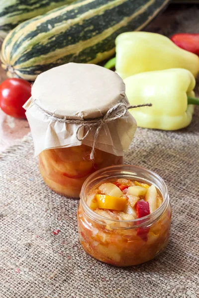 Homemade preserving. Zucchini and bell pepper salad in glass jar — Stock Photo, Image