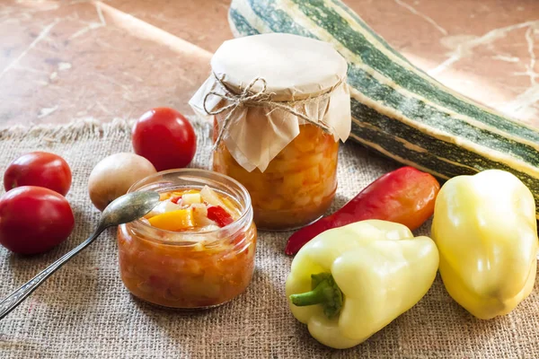 Homemade preserving. Zucchini and bell pepper salad in glass jar — Stock Photo, Image