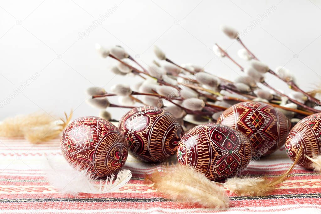 Easter still life with Pysanka on traditional Ukrainian cloth. Decorated Easter eggs, traditional for Eastern Europe culture. Copy space