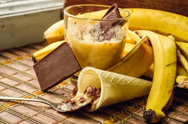 Ingredients for making banana smoothies. Chocolate powder