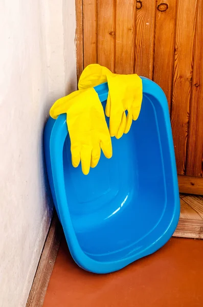 rubber gloves lie on the bowl
