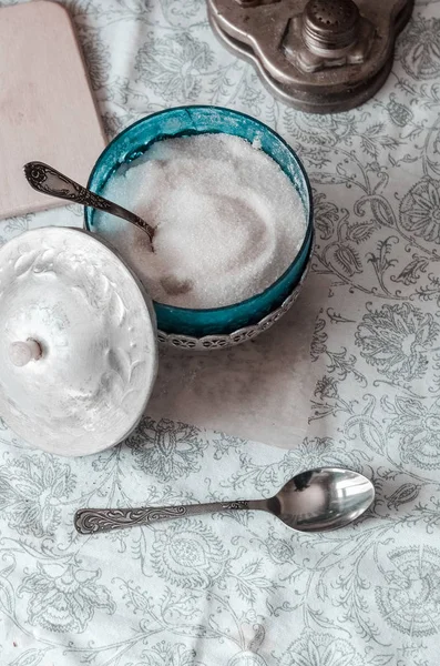 White sugar in an old sugar bowl