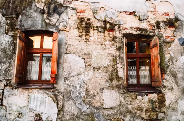 two vintage window. vintage. wooden windows. stone wall