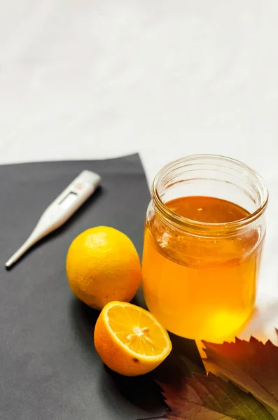 jar of honey. lemon. treatment