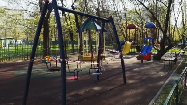 Playground. empty swing. deserts. swing ride and no children. quarantine. insulation — Stock Video