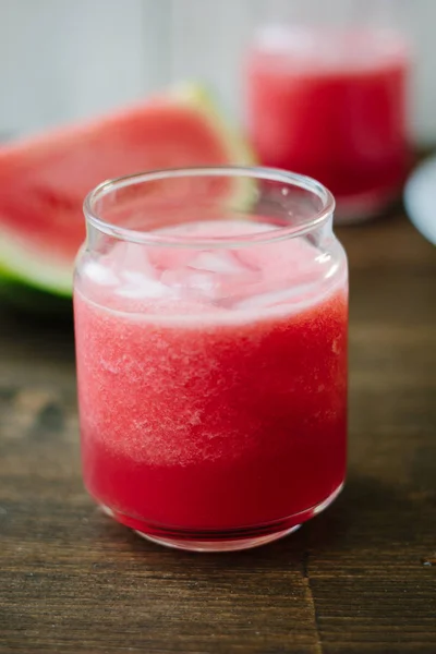 Delicious watermelon smoothie on the wooden board. Smoothie - vegetarian coctail from fresh fruit - watermelon — Stock Photo, Image