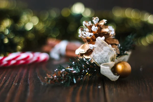 Christmas decoration with pinecone on wooden board. — Stock Photo, Image