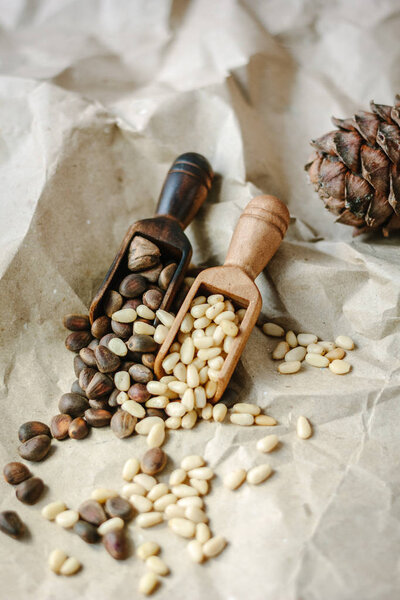 Two kinds of pine nuts - with shell and without shell.