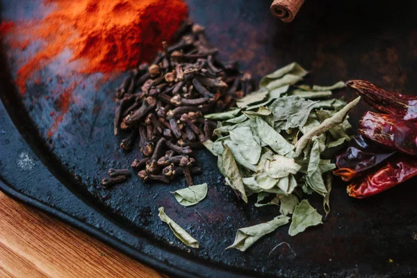 Set of different spices over black metal plate. — Stock Photo, Image