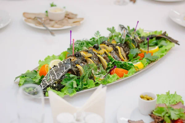 Big fish on table during catering event. Catering buffet.