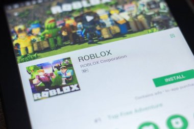 Ryazan, Russia - April 19, 2018 - Roblox mobile app on the display of tablet PC. clipart