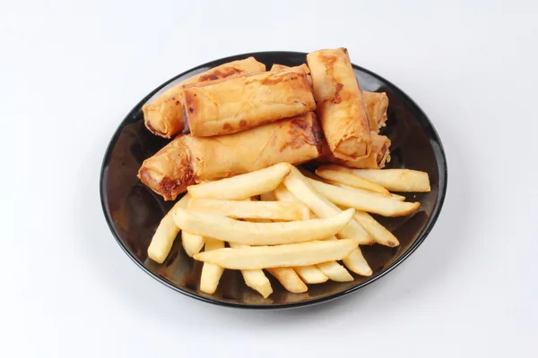 Chinese Vegetable festival  food as deep fried spring roll and French fries served.