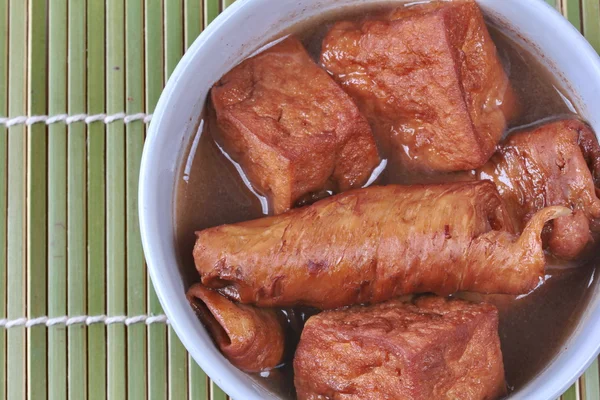 Chinese Vegetable festival  food as fried tofu and fermented flour in brown soup,