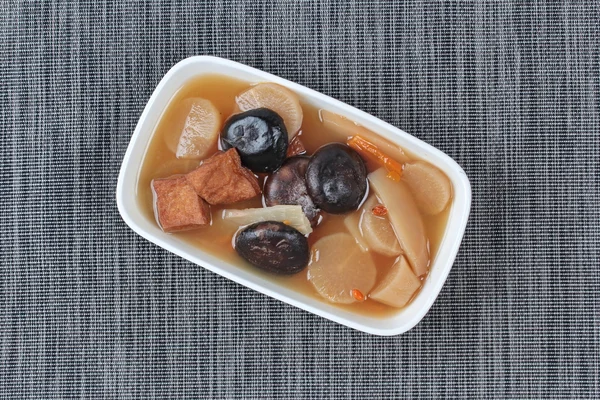 Chinese Vegetable festival  food as streamed Chinese medicine herb soup with tofu and Shiitake,  \