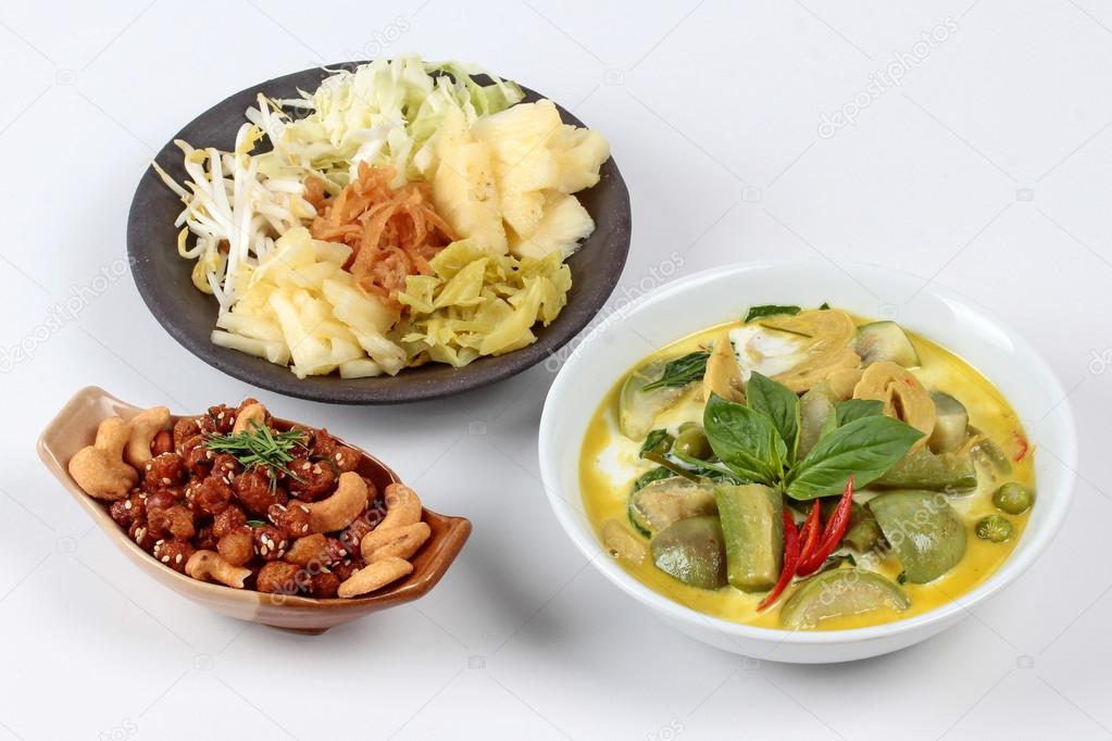 mixed vegetables and spicy fried textured soy protein curry served with side disk as bean sprouts,cabbage,sweet radish and pickle