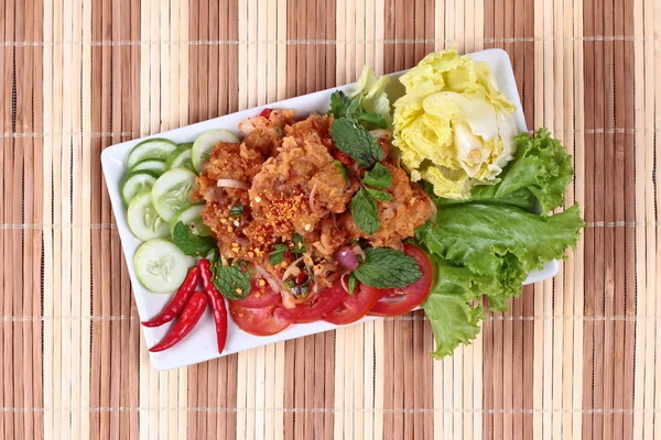 Home made,Spicy fried chicken salad (Yum Kai Zap in Thai)  topped cucumber,red chili,lettuce and cabbage. — Stock Photo, Image