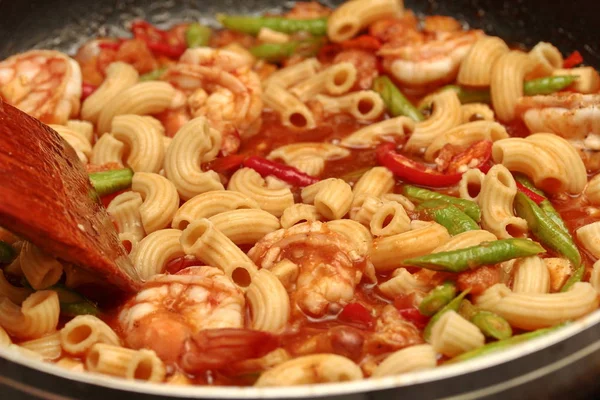 Hot cooking home made,fried macaroni with shrimp , call Pad Thai Macaroni in Thai .