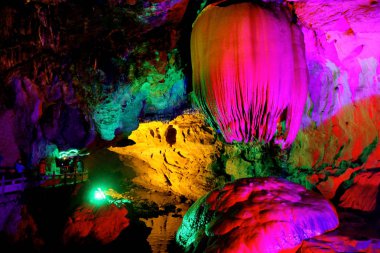 Colorful and beatiful refection of pool in Paya Dragon Cave.  clipart
