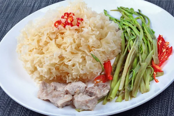 Thai spicy fried snow fungus mushroom with morning glory.