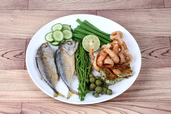 Ready side dish with fired mackarel ,pork rind  and vegetable.