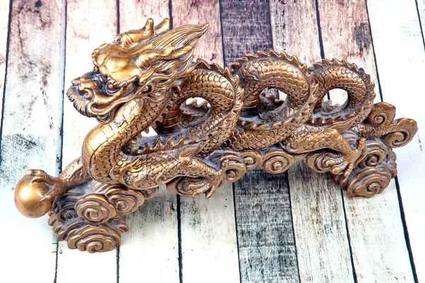 Golden dragon statue on wood ,to celebrate for Chinese festival.