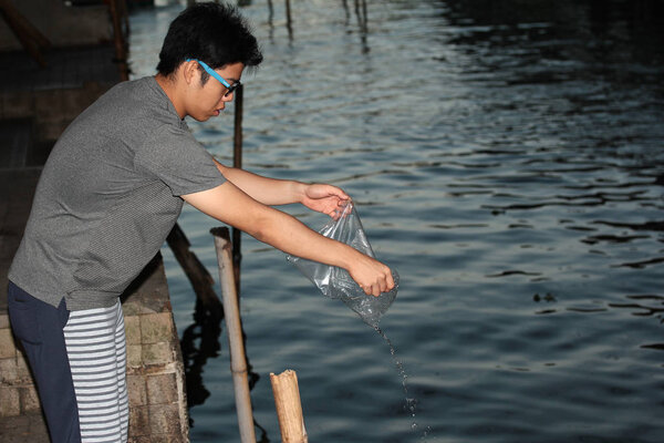 The release of aquatic animals back into the river.