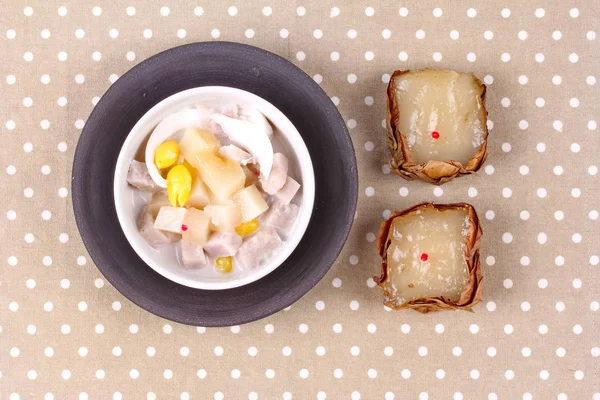 Nian gao dumplings and taro in coconut cream.