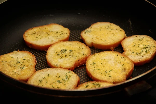 Cooking toast garlic bread in pan. — Stock Photo, Image