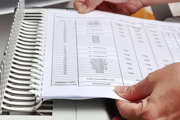 Binding documents with plastic ring binder.