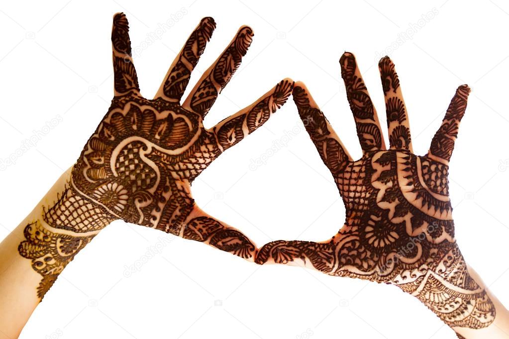 Show the beautiful Henna tattoo at the open hand.