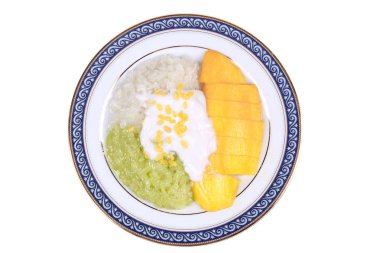 Yeşil ve beyaz yapışkan pirinç ile olgun altın mango.