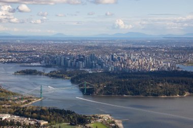 Aerial view of the City with Stanley Park and Downtown in the Background. Taken in Vancouver, British Columbia, Canada. clipart