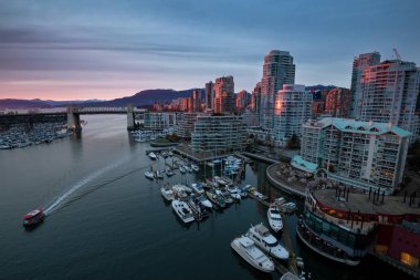 False Creek in Downtown Vancouver, British Columbia, Canada. Taken from an aerial perspective during a colorful sunset. clipart