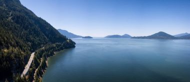 Aerial Panoramic Landscape view of Howe Sound and Sea to Sky Highway. Taken North of Vancouver, British Columbia, Canada, during a sunny summer day. clipart