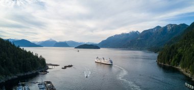 Aerial Panoramic view of Horseshoe Bay with Ferry leaving the terminal. Taken in Howe Sound, West Vancouver, British Columbia, Canada. clipart