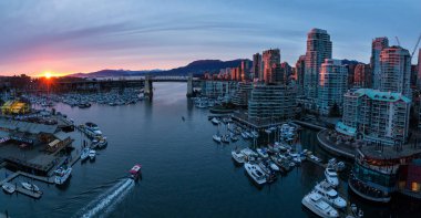 Aerial Panoramic View of Downtown Vancouver, BC, Canada around Granville Island Public Market and False Creek. Taken during a cloudy sunset. clipart