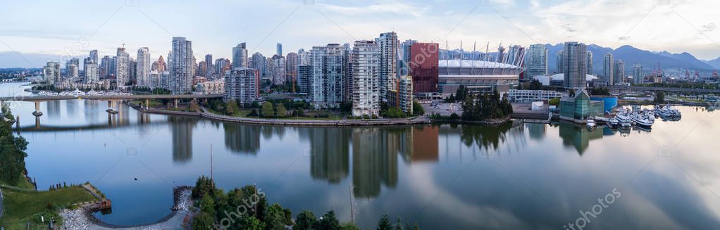 Panoramic City Skyline View of Downtown Vancouver around False Creek area from an Aerial Perspective. Taken in British Columbia, Canada, durin a colorful sunrise.