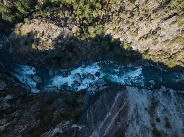 Aerial drone landscape view of Thompson River during a cloudy autumn day. Taken near Thompson River in the Interior of British Columbia, Canada.