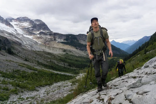 Outdoorsy adventure people are hiking thru the colorful meadows and forest. Picture taken far remote East of Vancouver and Seattle in Washington, USA. Concept of Adventure, Exploration and Journey.