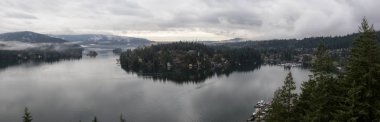 Beautiful panoramic view of Deep Cove from the Top of Quarry Rock. Taken in North Vancouver, British Columbia, Canada, during a vibrant winter morning. clipart