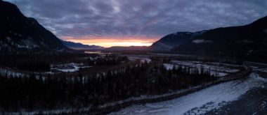 Aerial panoramic landscape view of a beautiful winter sunset. Taken near Chilliwack, East of Vancouver, BC, Canada. clipart
