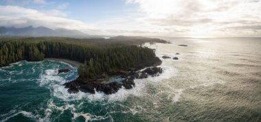 Aerial panoramic seascape view during a vibrant winter morning. Taken near Tofino and Ucluelet, Vancouver Island, British Columbia, Canada. clipart