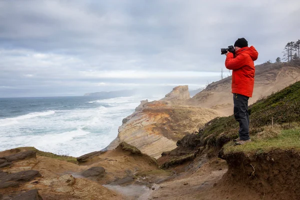 Adventurous Man Camera Standing Taking Pictures Beautiful Ocean Vibrant Winter — Stock Photo, Image