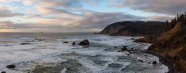 Panoramic Seascape view of a Beautiful Pacific Ocean Coast with a rugged rocky formation. Taken in Ecola State Park, Seaside, Cannon Beach, Oregon, USA. clipart
